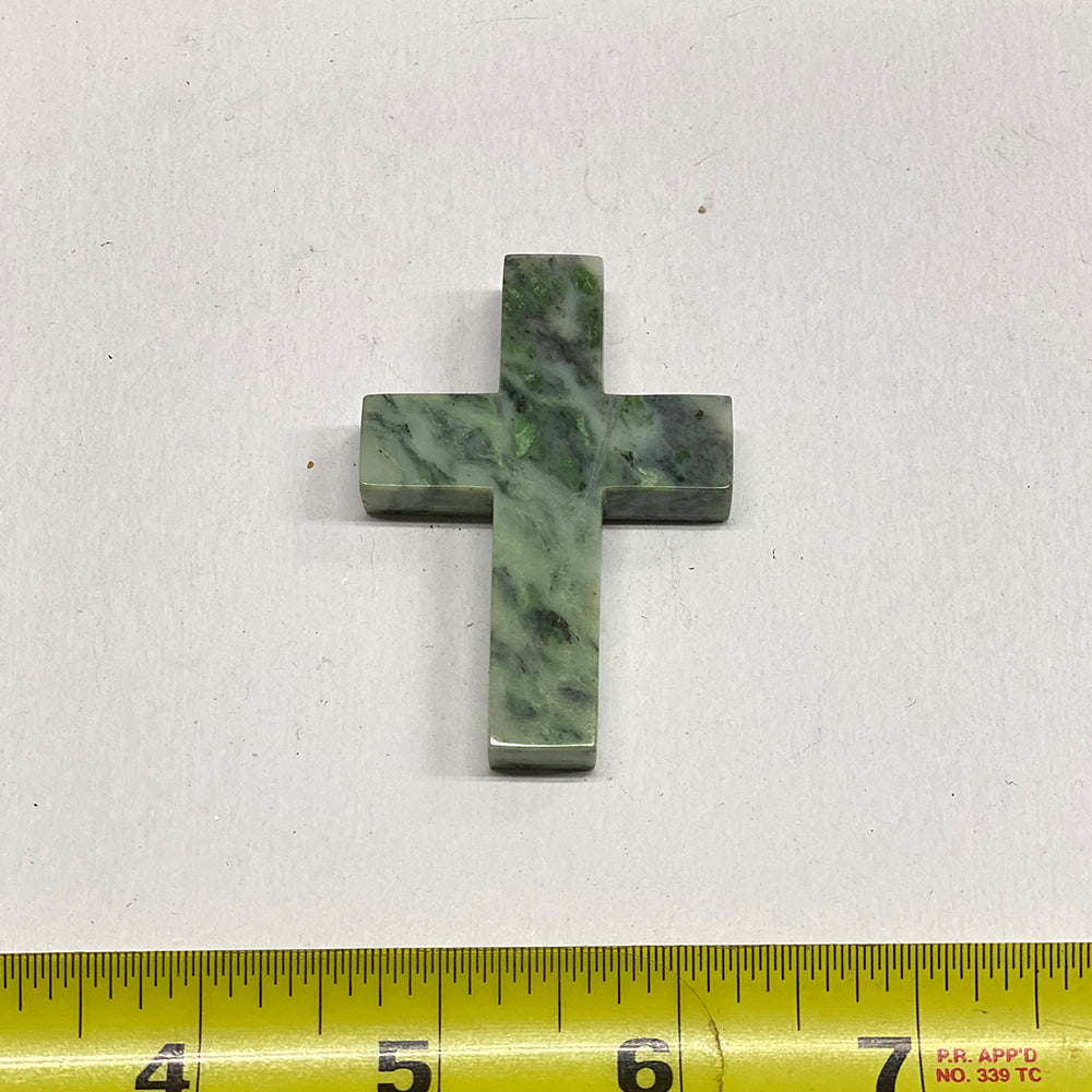 RiverBlossom Jade Cross Pendant.  A large cross cut into a perfect shape.   Fine jade and workmanship.  We drilled a sideways hole near the top of the cross for a cord.  The jade used in this piece was sourced from our helicopter trips to our private property in the Trinity Alps area in California.  We call this "RiverBlossomJade," as the winter storms create high water that delivers the jade for us to simply pick up as the water recedes in the summer.