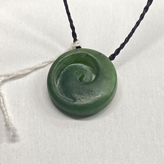 New Zealand Jade Maori Style Pendant.  I traded a traveling artist for a few of his pieces. This one has a matte finish and means new beginnings. Classic NZ style.