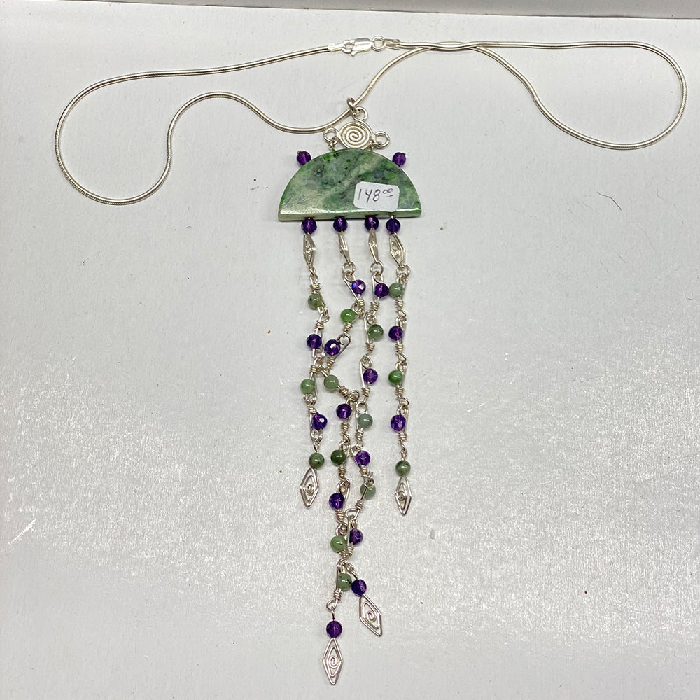 Unique RiverBlossom Jade and Amethyst Necklace Pendant.  Beautiful RiverBlossom Jade, Amethyst and Sterling wire worked pendant.  Absolutely no one will have a piece anything like this.  The jade used in this piece was sourced from our helicopter trips to our private property in the Trinity Alps area in California.