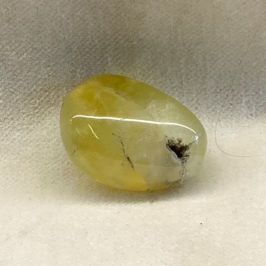Prehnite with Black Tourmaline Bead.  Limey yellowish green with contrasting flecks of Black Tourmaline.   Varied, unique patterns.  Size: approx. .75 inches.