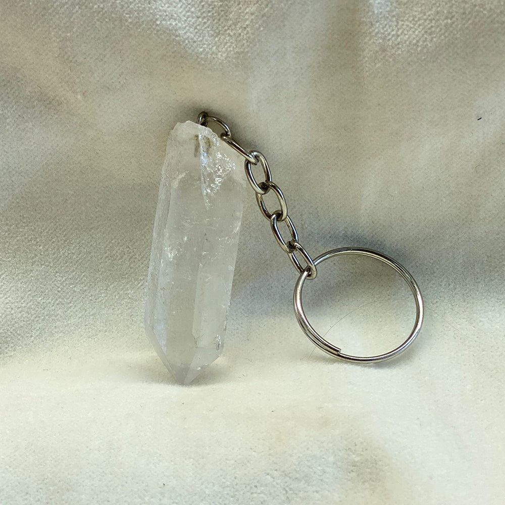Clear Quartz Keychain Accessory.  Clear Quartz Crystal with attached chain and keyring.  Size (crystal): 1.5 inches.
