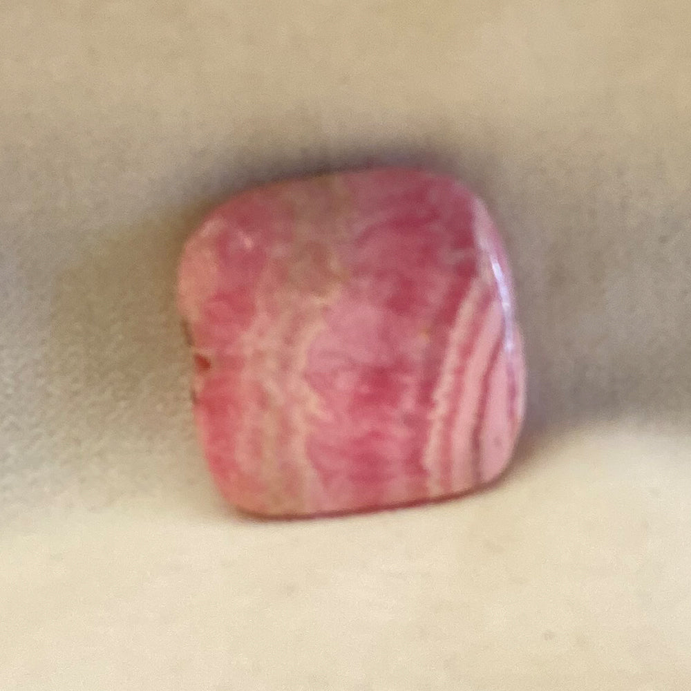 Rhodochrosite Square Bead.  Polished smooth.  Pink with classic white accents.  Stringing hole through center.  Size 1 inch.   Really nice quality and hard to find.   Mystics call Rhodochrosite the stone of Love.