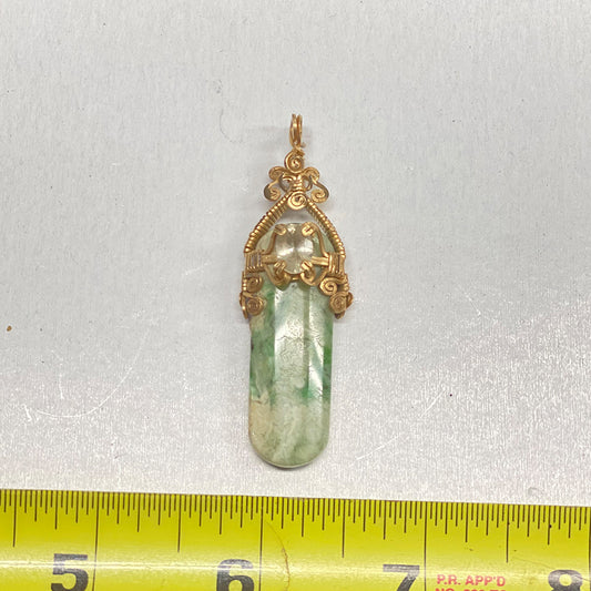RiverBlossom Jade and Sunstone Pendant.  Heavy gold filled wire with a prong set, faceted Oregon Sunstone.  One of a kind.