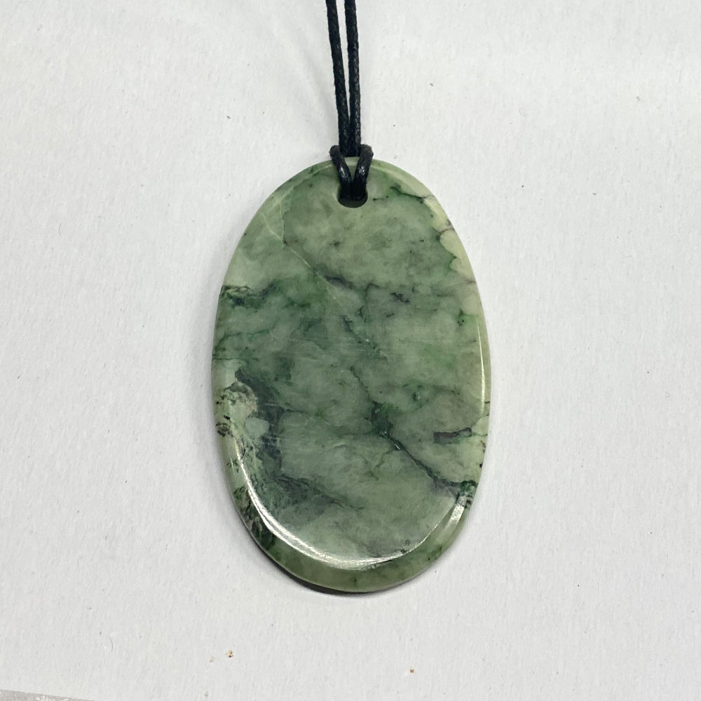 Brilliant polish, good size and pattern in this unique Made in Mendocino, CA piece.  The Jade used in this piece was sourced from our helicopter trips to our private property in the Trinity Alps area in Northern California. We call this "RiverBlossom Jade."  Winter storms create high water that delivers the Jade for us to simply pick up as the water recedes in the summer. One of a kind. Size is 3x2 inches.  Pictured piece is exactly the piece you will receive. 