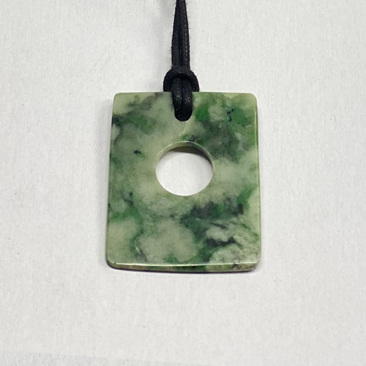 RiverBlossom Jade Rectangle Pendant.  Great design seldom seen.  Very thin and light with great color and pattern.  The Jade used in this piece was sourced from our helicopter trips to our private property in the Trinity Alps area in California.