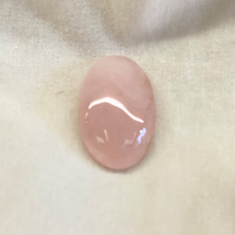 Rose Quartz Cabochons.  Pink translucent stone.  Smooth oval shape with curved face.  Size approx: 1+ in.  Rose Quartz lore says it is a stone that will attract love.