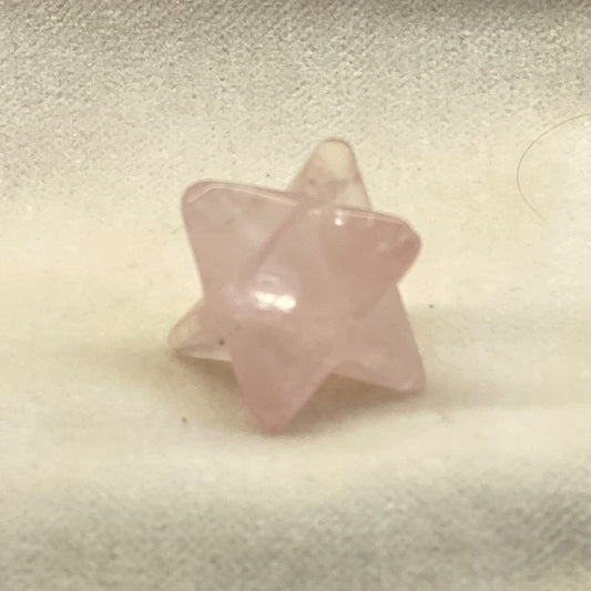 Handcrafted Rose Quartz Merkabah.  A powerful ancient sacred geometry shape in a pleasing rosy pink color.  Size: approx. 3/4 inch.  The Merkabah is a star tetrahedron.  The 2 intersecting pyramids are said to balance your inner powers and attract immense energy to help with your current needs.